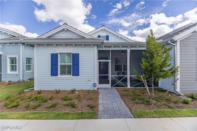 7174 Saona Ct, Naples, FL 34113 - view of front facade with a sunroom