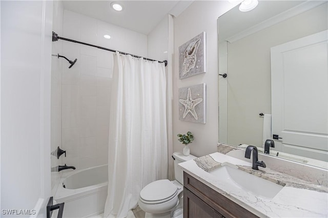 full bathroom featuring vanity, shower / bath combo, and toilet