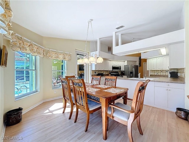 dining area with light hardwood / wood-style flooring