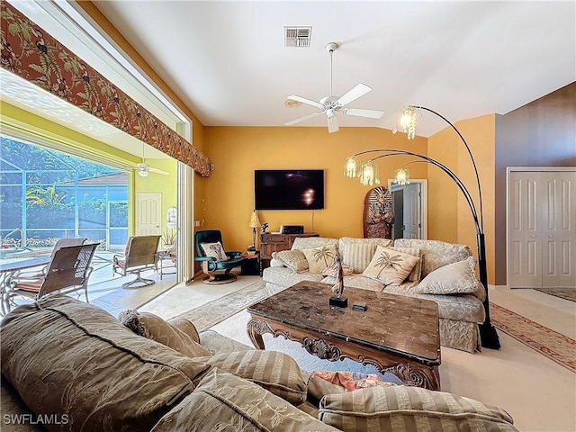 living room featuring vaulted ceiling, ceiling fan, and carpet floors