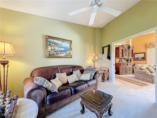 living room with ceiling fan and carpet flooring