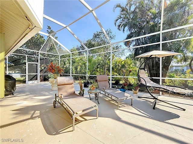 view of patio / terrace featuring area for grilling and a lanai