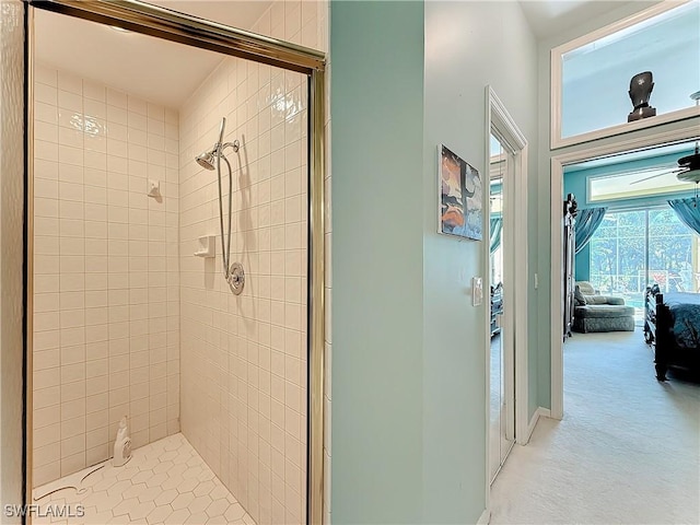 bathroom featuring a shower with shower door