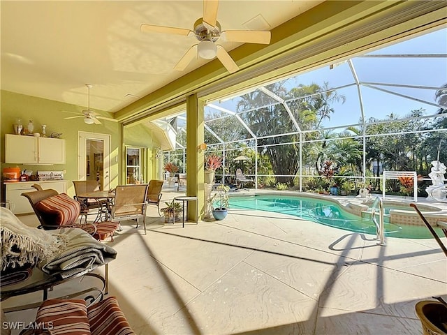 view of swimming pool featuring a lanai, ceiling fan, and a patio area