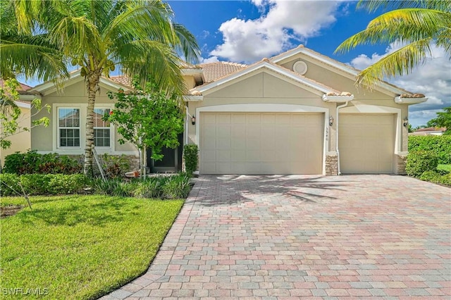 view of front facade with a garage and a front yard