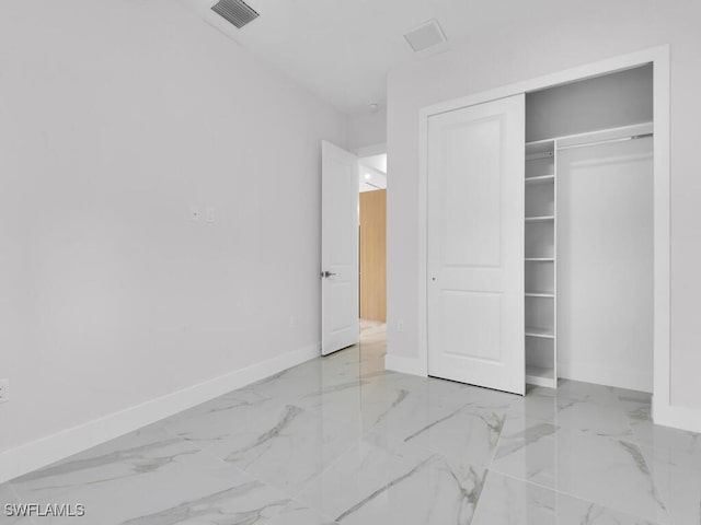 unfurnished bedroom with a closet