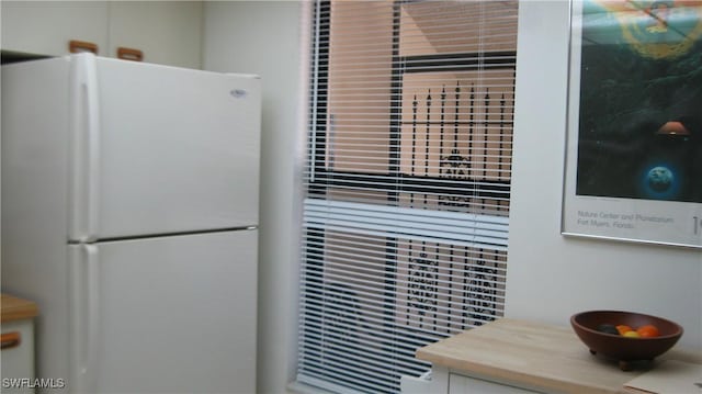 room details featuring white fridge