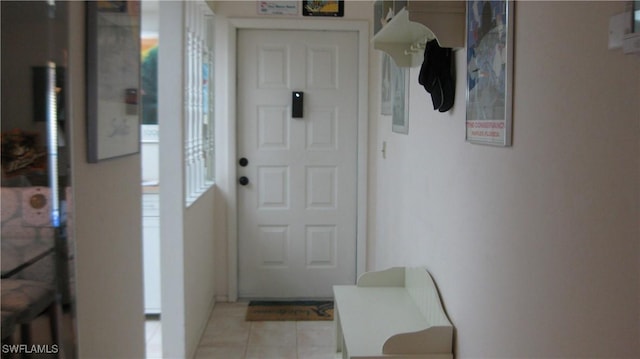 entryway featuring light tile patterned floors