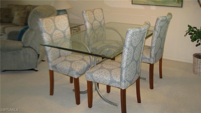 dining room featuring light colored carpet