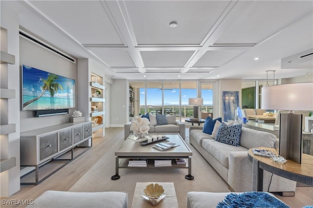 living room featuring expansive windows, coffered ceiling, and light hardwood / wood-style flooring