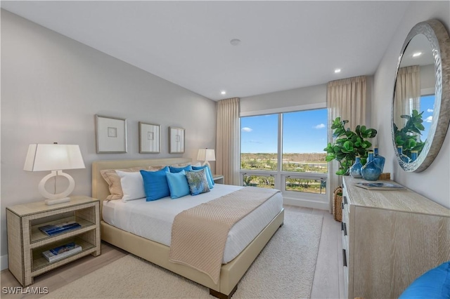 bedroom with light hardwood / wood-style flooring