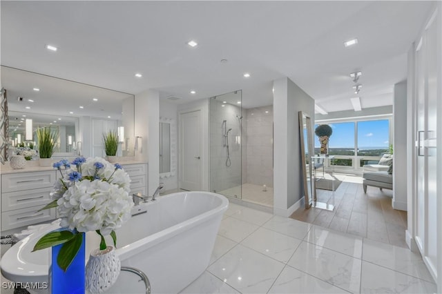 bathroom with vanity and plus walk in shower