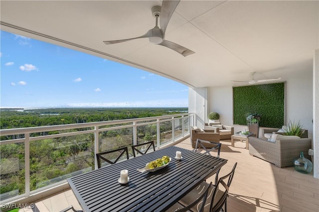 balcony with an outdoor hangout area and ceiling fan