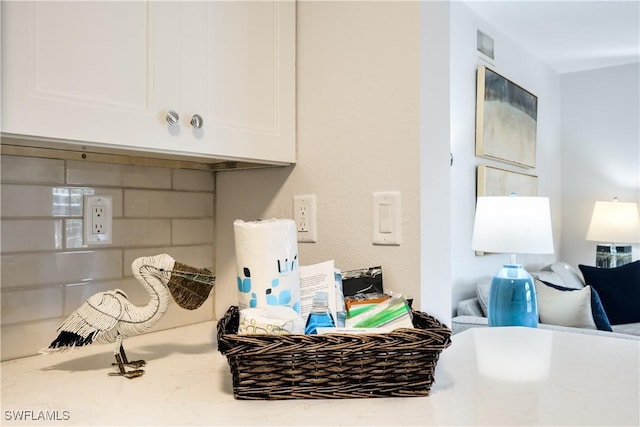 details with tasteful backsplash and white cabinetry