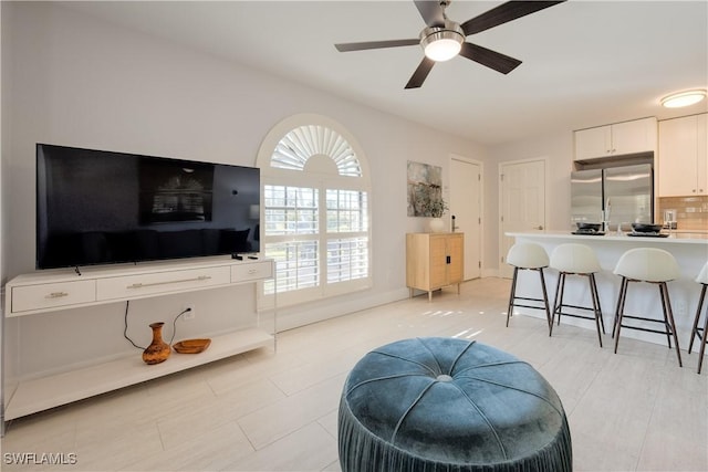 living room with ceiling fan