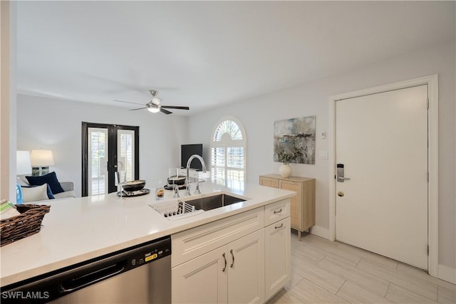 kitchen featuring sink, white cabinets, dishwasher, and ceiling fan