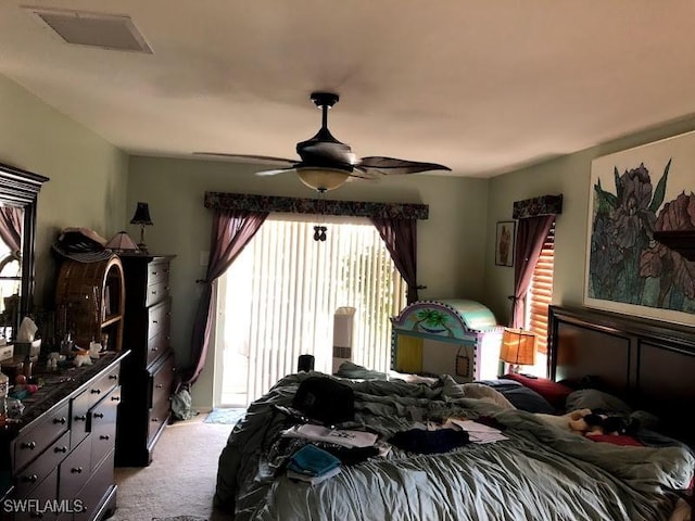 bedroom with ceiling fan and light carpet