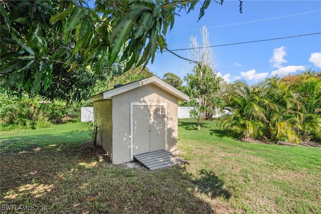 view of outdoor structure featuring a yard