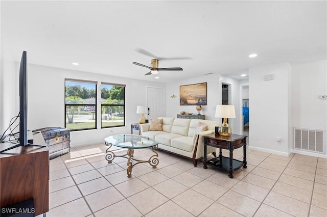 living room with ceiling fan and light tile patterned floors