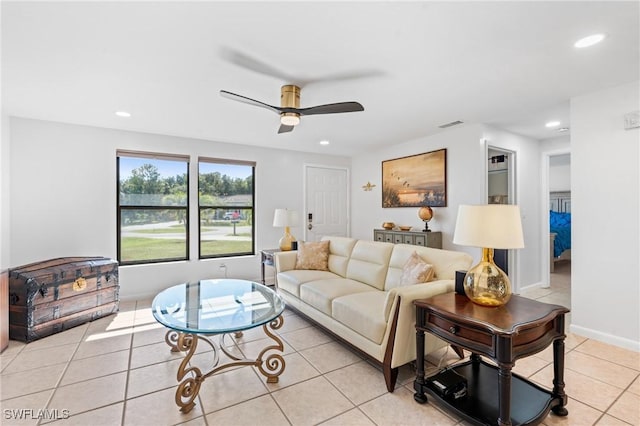 living room with light tile patterned floors and ceiling fan