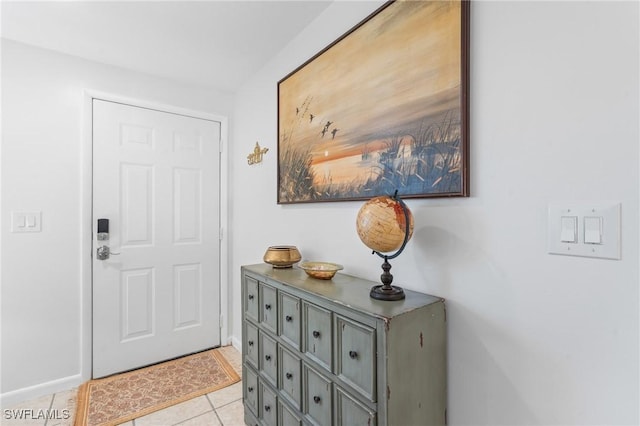 entrance foyer with light tile patterned floors