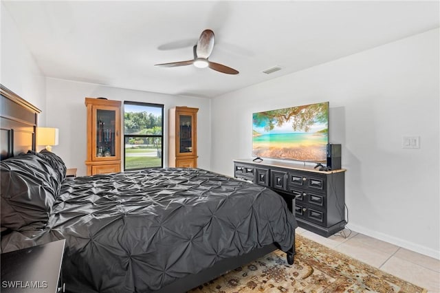 bedroom featuring light tile patterned floors and ceiling fan