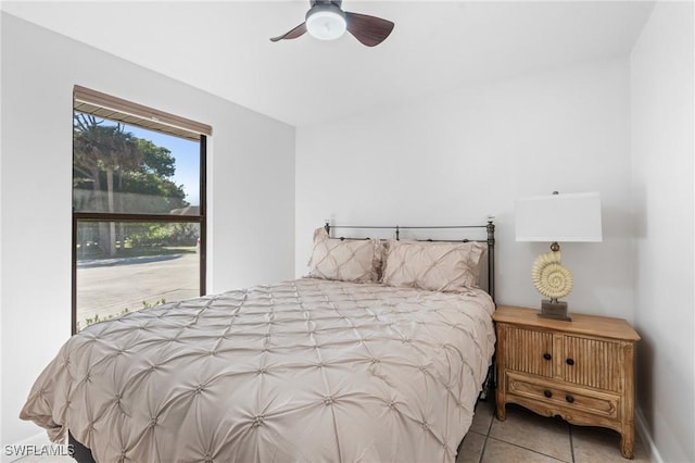 tiled bedroom with ceiling fan