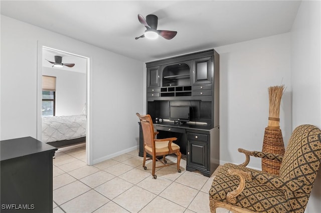 tiled home office with ceiling fan