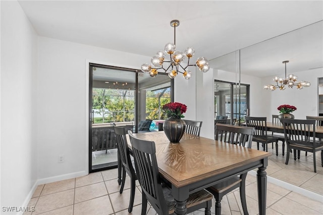 tiled dining area featuring a notable chandelier