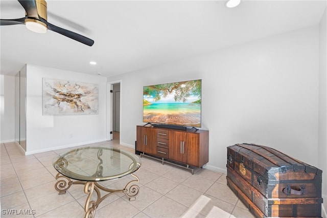 living room with ceiling fan and light tile patterned floors