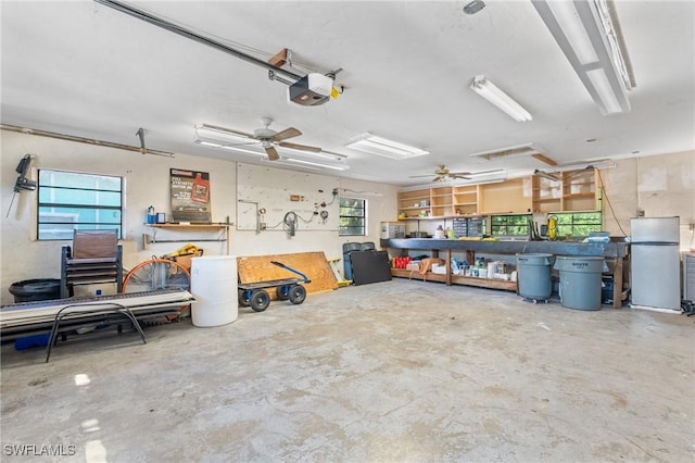 garage featuring a garage door opener and a workshop area