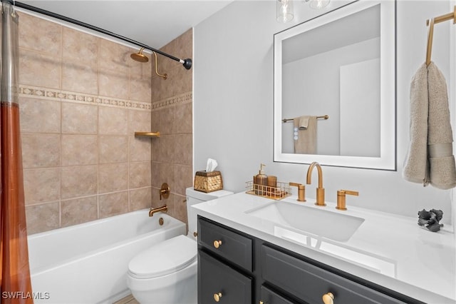 full bathroom with vanity, tiled shower / bath combo, and toilet