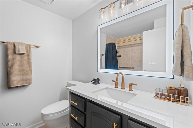 bathroom with vanity, curtained shower, and toilet