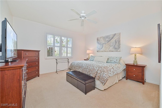 bedroom featuring light colored carpet and ceiling fan