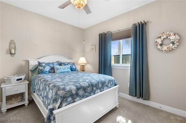 bedroom featuring ceiling fan, carpet floors, and baseboards