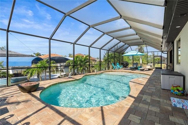 pool featuring a lanai and a patio