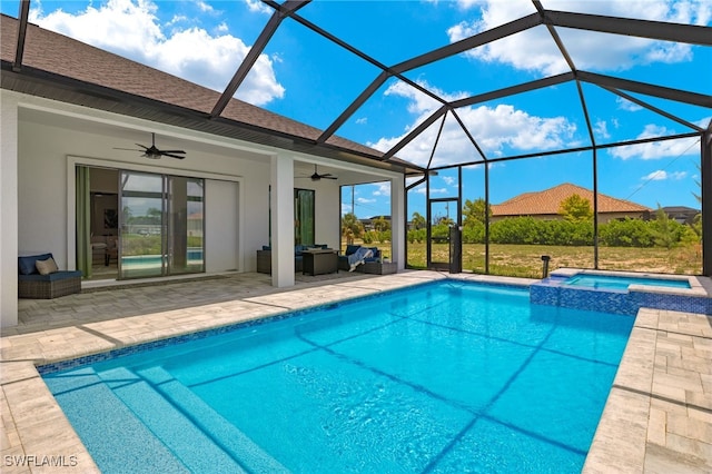 view of pool with a patio, outdoor lounge area, an in ground hot tub, ceiling fan, and glass enclosure