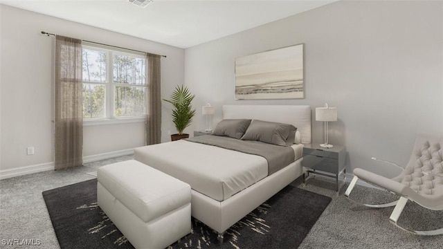 bedroom featuring carpet floors, visible vents, and baseboards