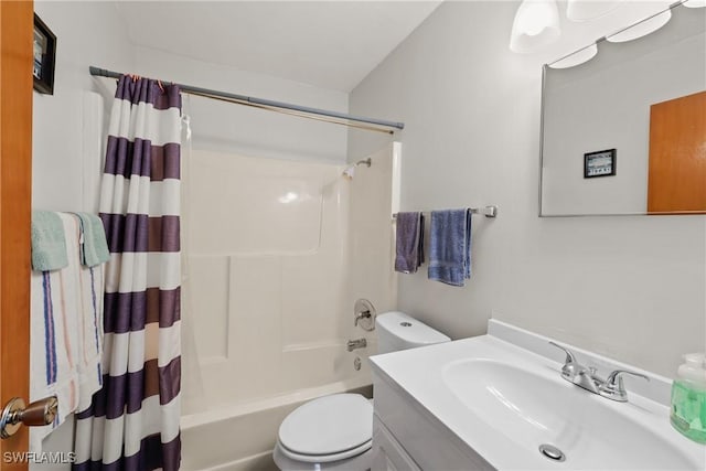 full bathroom with vanity, shower / tub combo with curtain, and toilet