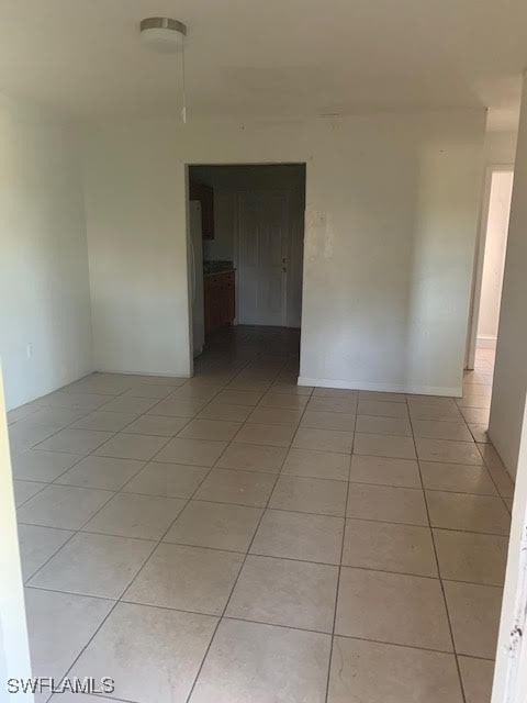 spare room with light tile patterned floors