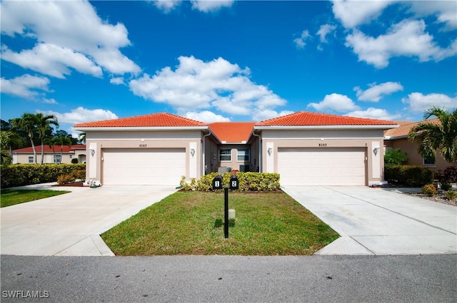 view of front of home featuring a garage and a front yard