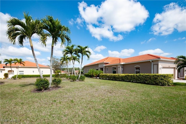 view of yard featuring a garage