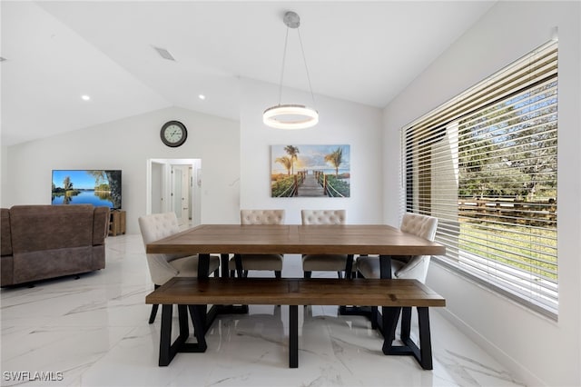 dining area with vaulted ceiling