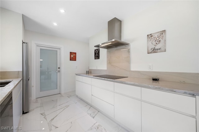 kitchen with island range hood, light stone countertops, and white cabinets