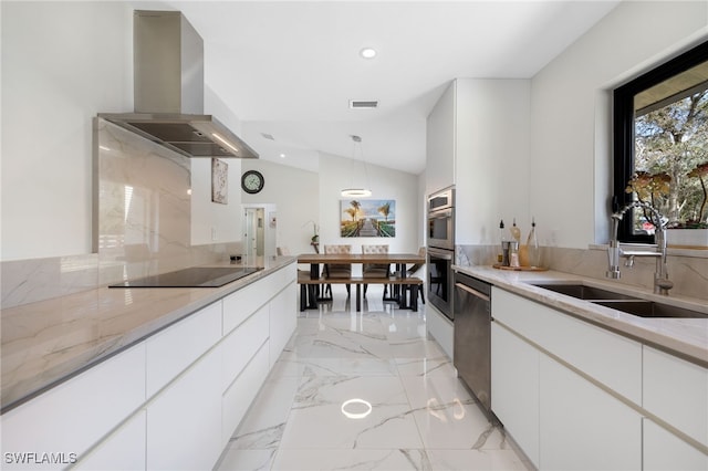 kitchen featuring sink, stainless steel appliances, extractor fan, white cabinets, and decorative light fixtures