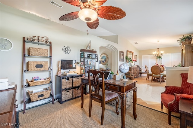 dining space with lofted ceiling and ceiling fan with notable chandelier