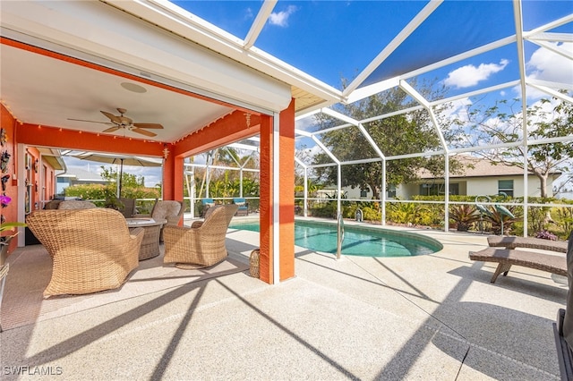 view of pool featuring a patio, a lanai, and ceiling fan