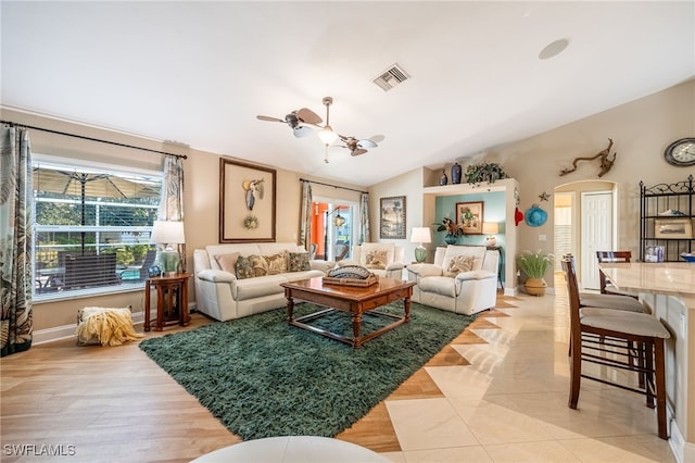 living room with lofted ceiling and ceiling fan