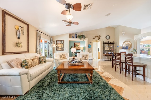 living room with lofted ceiling and ceiling fan