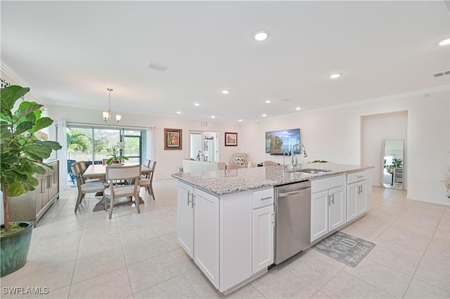 kitchen with sink, white cabinetry, stainless steel dishwasher, pendant lighting, and a kitchen island with sink